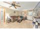 Comfortable living room with tile flooring, ceiling fan, and natural light at 3800 Ne 24Th Ct, Ocala, FL 34479