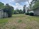 Expansive backyard area with shed, offering plenty of outdoor space and privacy at 3885 Ne 28Th Ter, Ocala, FL 34479