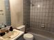 Bathroom with tiled shower-tub and sink vanity, offering a functional space at 3885 Ne 28Th Ter, Ocala, FL 34479