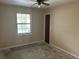 Bright bedroom with a window and closet, offering potential for personalization at 3885 Ne 28Th Ter, Ocala, FL 34479