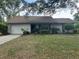 Charming single-story home featuring an attached garage and a well-maintained lawn at 3885 Ne 28Th Ter, Ocala, FL 34479