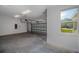 Spacious two car garage with natural lighting and a concrete floor at 5830 Sw 121St Ter, Ocala, FL 34481