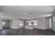 Spacious open-concept kitchen features white cabinetry, a center island, and stainless steel appliances at 5830 Sw 121St Ter, Ocala, FL 34481