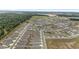 Birds eye view of a community with modern, single-Gathering homes, green spaces, and surrounding natural landscape at 6486 Sw 75Th Avenue Rd, Ocala, FL 34474