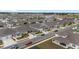 Overhead shot of a meticulously planned neighborhood with uniform houses and landscaped yards in a serene setting at 6486 Sw 75Th Avenue Rd, Ocala, FL 34474