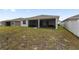 View of backyard, enclosed lanai and neighboring properties at 6486 Sw 75Th Avenue Rd, Ocala, FL 34474