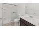 Bathroom featuring a shower stall, large vanity and mirror, toilet, and tile flooring at 6486 Sw 75Th Avenue Rd, Ocala, FL 34474