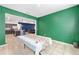 A spacious dining room with green walls connecting to the kitchen and living spaces at 6486 Sw 75Th Avenue Rd, Ocala, FL 34474