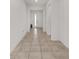 Bright hallway with tiled flooring, leading to the front door and other areas of the home at 6486 Sw 75Th Avenue Rd, Ocala, FL 34474