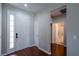 Bright entryway with hardwood floors, a white front door, and an open view to the adjacent rooms at 6984 Sw 94Th Ct, Ocala, FL 34481