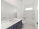 Bathroom featuring vanity, toilet and tub with shower at 7638 Sw 60Th St, Ocala, FL 34474