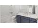 Bathroom featuring vanity, toilet and tub with shower at 7638 Sw 60Th St, Ocala, FL 34474