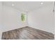 Bedroom with natural light, wood-look floors, and neutral walls at 7638 Sw 60Th St, Ocala, FL 34474