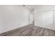 Neutral bedroom with wood-look flooring, closet, and doorway at 7638 Sw 60Th St, Ocala, FL 34474