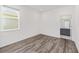 This room offers a window, neutral walls and flooring, and an open doorway to the bathroom at 7638 Sw 60Th St, Ocala, FL 34474