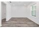Bedroom featuring wood-look flooring, neutral walls, and natural light at 7638 Sw 60Th St, Ocala, FL 34474