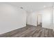 Spacious bedroom with wood-look floors, offering a serene and comfortable atmosphere at 7638 Sw 60Th St, Ocala, FL 34474
