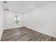 Bonus room featuring neutral walls, modern flooring, a window and two doors for entry at 7638 Sw 60Th St, Ocala, FL 34474
