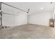Spacious two-car garage featuring a new water heater, cement flooring and a bright white paint at 7638 Sw 60Th St, Ocala, FL 34474