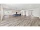 Open-concept kitchen and living room with an island and stainless steel appliances at 7638 Sw 60Th St, Ocala, FL 34474