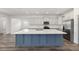 Large kitchen island with white countertops, and stainless steel appliances at 7638 Sw 60Th St, Ocala, FL 34474