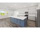 Spacious kitchen with a large island and stainless steel appliances at 7638 Sw 60Th St, Ocala, FL 34474