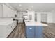 Modern kitchen with an island, stainless steel appliances, and plenty of cabinet space at 7638 Sw 60Th St, Ocala, FL 34474