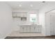 Bright laundry room with cabinets, sink and countertop space at 7638 Sw 60Th St, Ocala, FL 34474