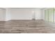 Spacious living room with wood flooring and lots of natural light from sliding glass doors at 7638 Sw 60Th St, Ocala, FL 34474