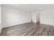 Large living area with wood-look floors, recessed lighting, and access to hallways at 7638 Sw 60Th St, Ocala, FL 34474