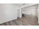 Open floor plan with wood-look flooring, neutral walls, and plenty of natural light at 7638 Sw 60Th St, Ocala, FL 34474
