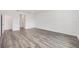 Spacious living room featuring wood-look floors, recessed lighting, and access to other rooms at 7638 Sw 60Th St, Ocala, FL 34474