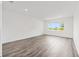 Spacious living room with recessed lighting, wood-look floors, and a large window providing natural light at 7638 Sw 60Th St, Ocala, FL 34474