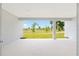 View from covered patio of verdant green space in backyard, featuring well manicured trees at 7638 Sw 60Th St, Ocala, FL 34474