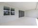 A covered patio with sliding glass doors and a large window brings the outdoors in for indoor/outdoor living at 7638 Sw 60Th St, Ocala, FL 34474