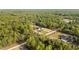 Aerial view shows home and ample yard surrounded by lush forest at 8200 Sw 125Th Court Rd, Dunnellon, FL 34432