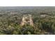 Overhead view of neighborhood of homes nestled in serene wooded area at 8200 Sw 125Th Court Rd, Dunnellon, FL 34432