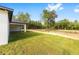 Expansive backyard featuring lush grass and view of the covered patio at 8200 Sw 125Th Court Rd, Dunnellon, FL 34432