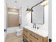 Well-lit bathroom featuring modern vanity, tub, and stylish fixtures at 8200 Sw 125Th Court Rd, Dunnellon, FL 34432
