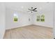 Bright bedroom with ample natural light, a ceiling fan, and wood-look flooring at 8200 Sw 125Th Court Rd, Dunnellon, FL 34432