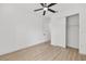 Bright bedroom with wood-look flooring, ceiling fan, and a closet at 8200 Sw 125Th Court Rd, Dunnellon, FL 34432