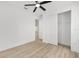 Bright bedroom features wood-look floors, ceiling fan, and closet for ample storage at 8200 Sw 125Th Court Rd, Dunnellon, FL 34432