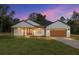 Charming single-story home with a well-manicured lawn, brown garage door and inviting covered porch at 8200 Sw 125Th Court Rd, Dunnellon, FL 34432
