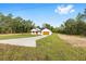 Single-story home on a large lot with a long driveway and a charming covered entryway at 8200 Sw 125Th Court Rd, Dunnellon, FL 34432