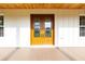 Stylish double front doors with glass panels, accented by a wood ceiling, offering an inviting entrance at 8200 Sw 125Th Court Rd, Dunnellon, FL 34432