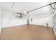 Spacious garage with sealed floor, overhead lighting and ample room for storage at 8200 Sw 125Th Court Rd, Dunnellon, FL 34432