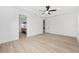 Spacious main bedroom with modern decor, ensuite bathroom, and luxury vinyl plank flooring at 8200 Sw 125Th Court Rd, Dunnellon, FL 34432