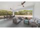 Covered patio with ample seating and dining space, perfect for enjoying outdoor living with peaceful views at 8200 Sw 125Th Court Rd, Dunnellon, FL 34432