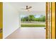 Covered patio featuring a ceiling fan and view of the lush backyard at 8200 Sw 125Th Court Rd, Dunnellon, FL 34432