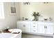 Bright bathroom with double vanity, granite countertops, and a freestanding tub at 8290 Nw 17Th Cir, Ocala, FL 34475